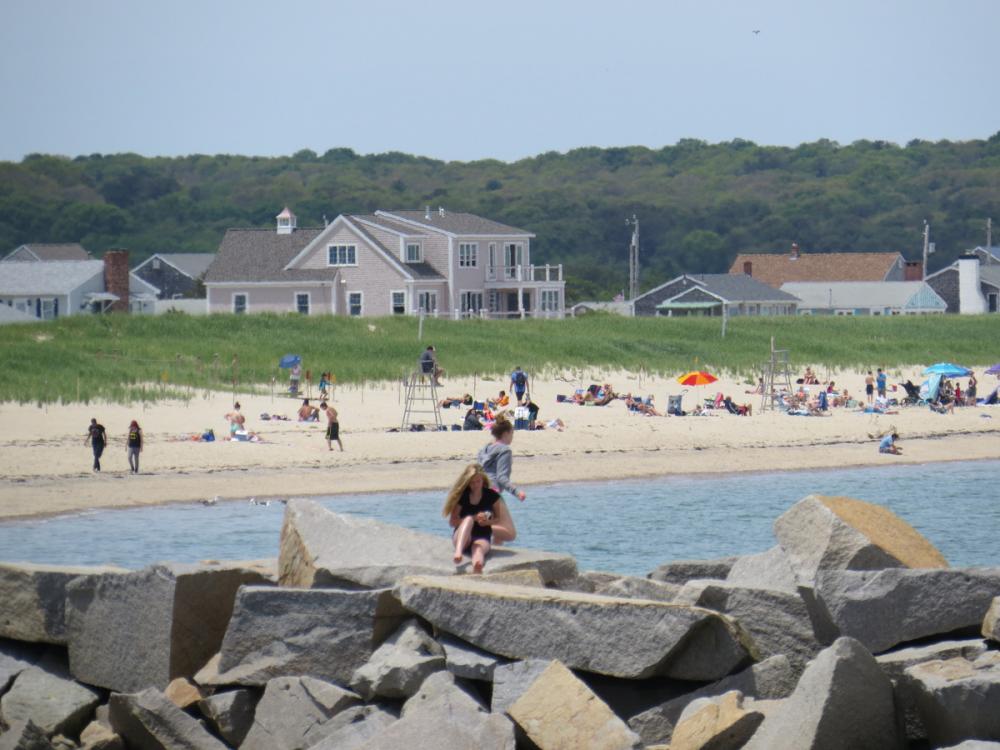 Cape Cod beachgoers getting just their toes wet in the cold water June, 2015